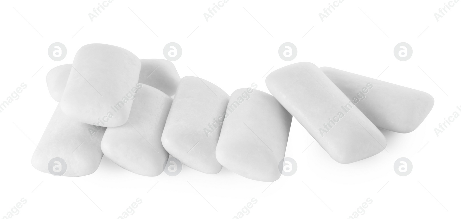 Photo of Pile of tasty chewing gums on white background