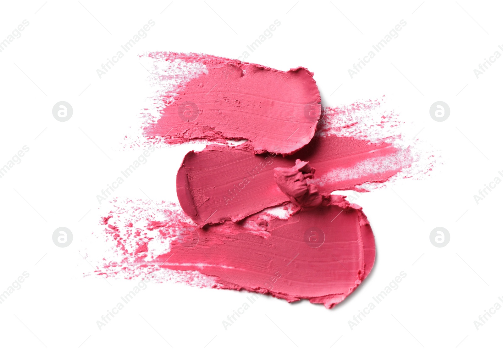 Photo of Smears of bright lipstick on white background, top view