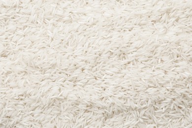 Photo of Raw basmati rice as background, top view