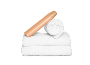 Photo of Soft terry towels with cosmetic product on white background
