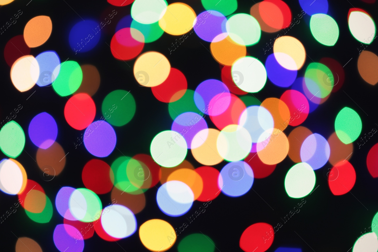 Photo of Beautiful colorful lights on dark background. Bokeh effect