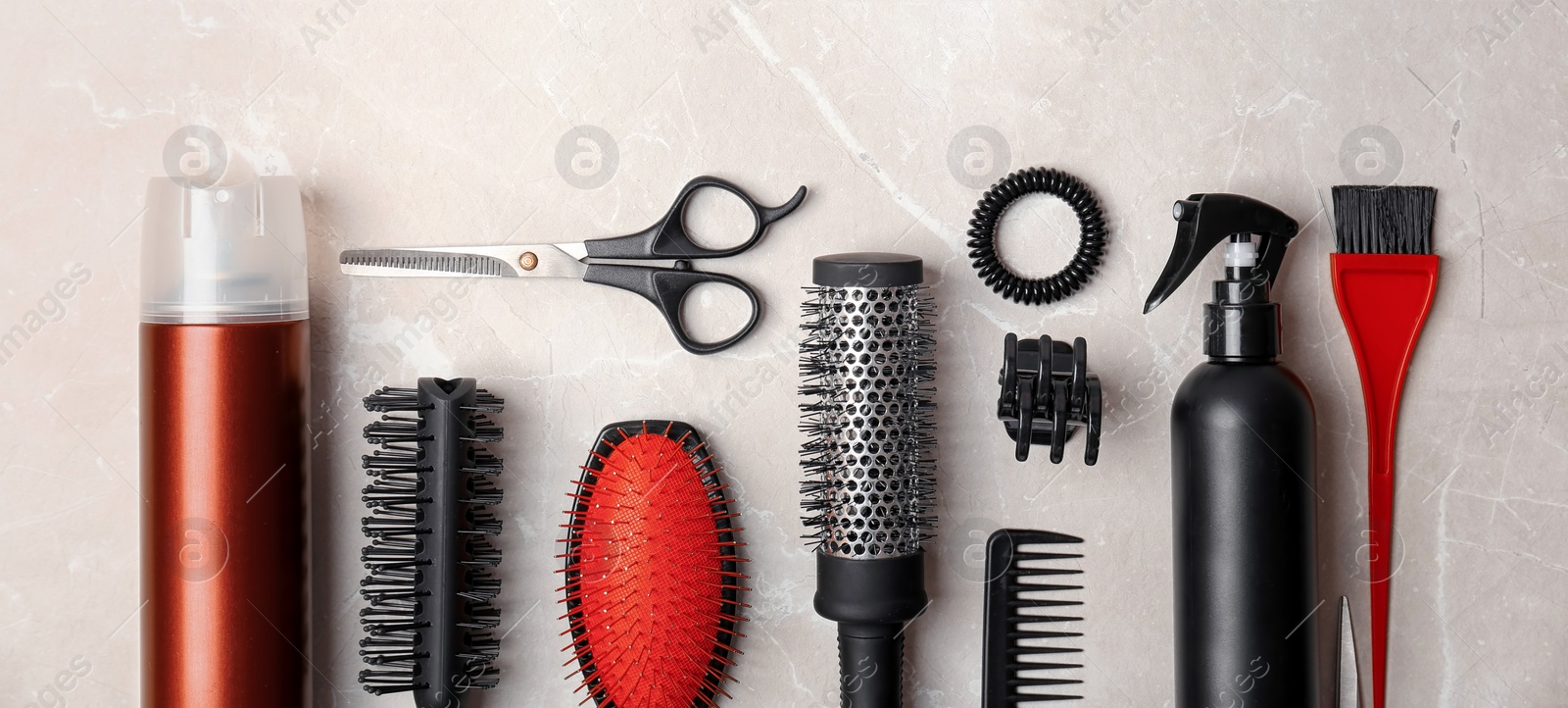 Image of Set of different professional hairdresser tools on light grey marble table, flat lay. Banner design