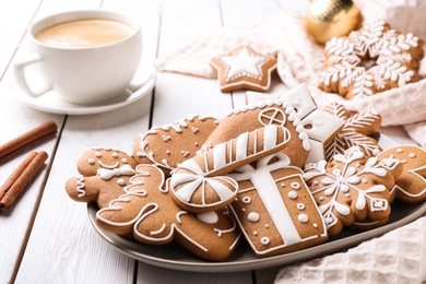 Photo of Delicious Christmas cookies on white wooden table
