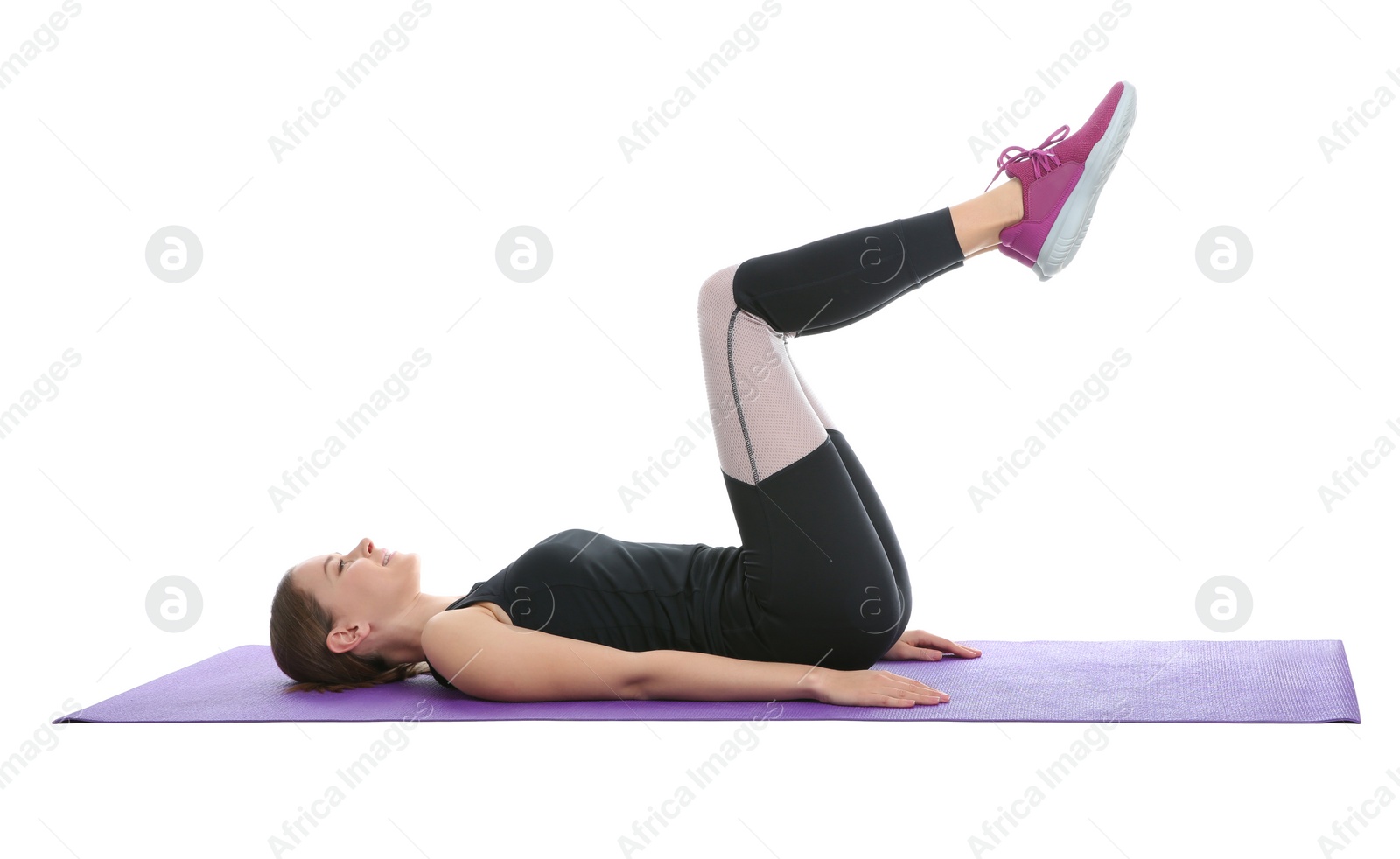 Photo of Young woman doing sports exercises isolated on white. Home fitness