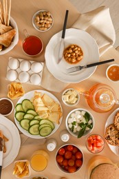 Photo of Dishes with different food on table, flat lay. Luxury brunch