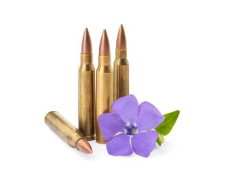 Photo of Bullets and beautiful flower on white background. Peace instead of war