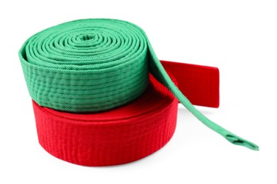 Photo of Green and red karate belts isolated on white