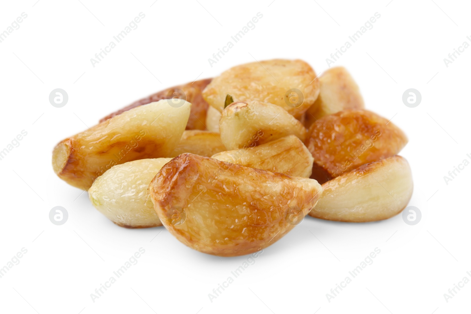 Photo of Pile of fried garlic cloves isolated on white