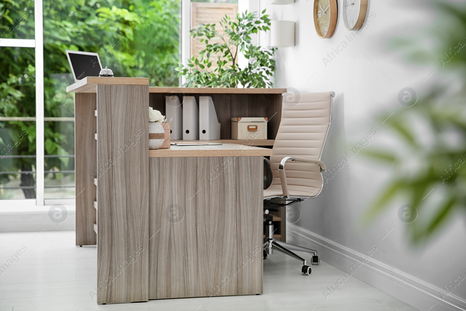 Photo of Receptionist desk in hotel. Workplace interior