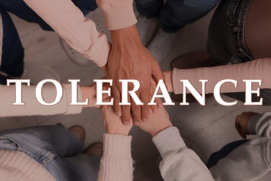 Image of Tolerance, support and cooperation concept. Group of multiracial people joining hands together, top view