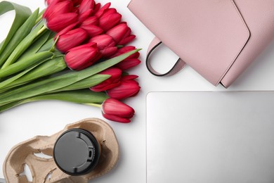 Photo of Flat lay composition with beautiful tulips and laptop on white table