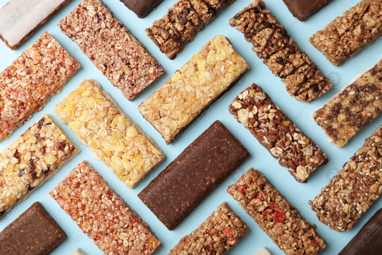 Photo of Flat lay composition with protein bars on color background