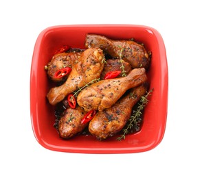 Photo of Chicken legs glazed with soy sauce, black sesame, chili and thyme isolated on white, top view