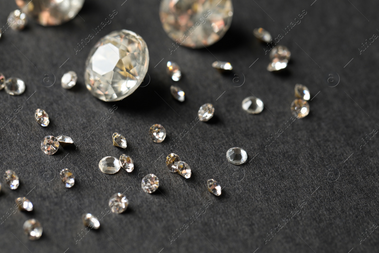Photo of Beautiful gemstones for jewelry on grey background