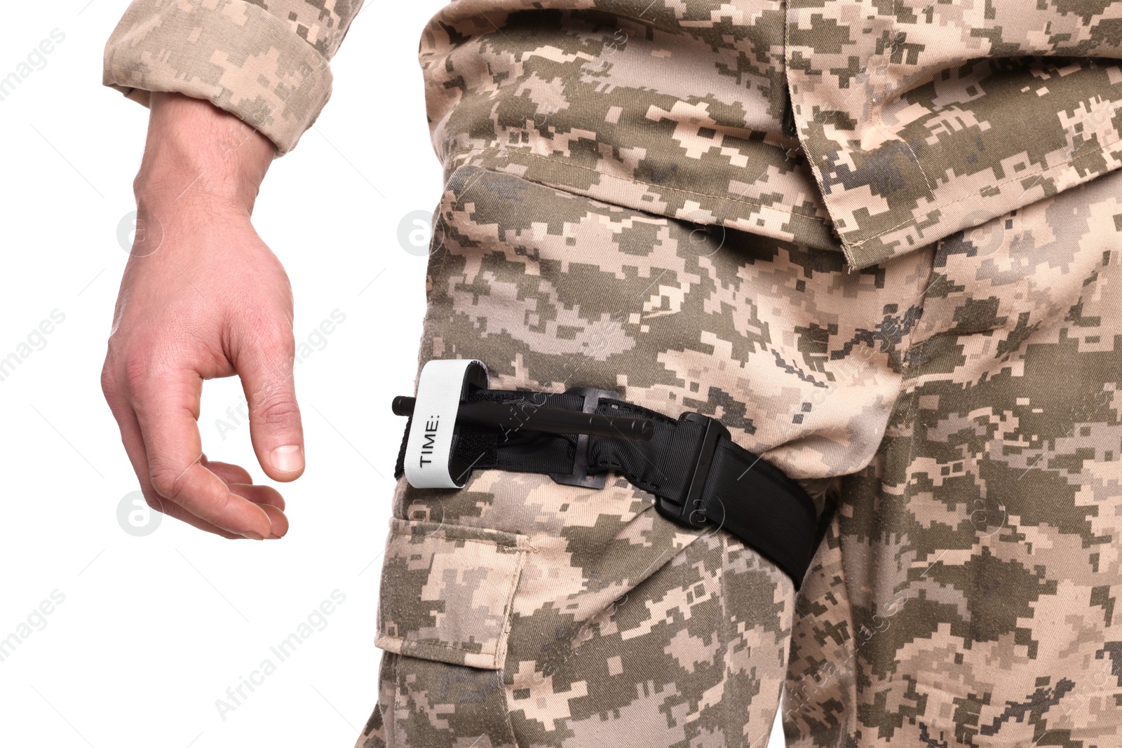 Photo of Soldier in military uniform with medical tourniquet on leg against white background, closeup