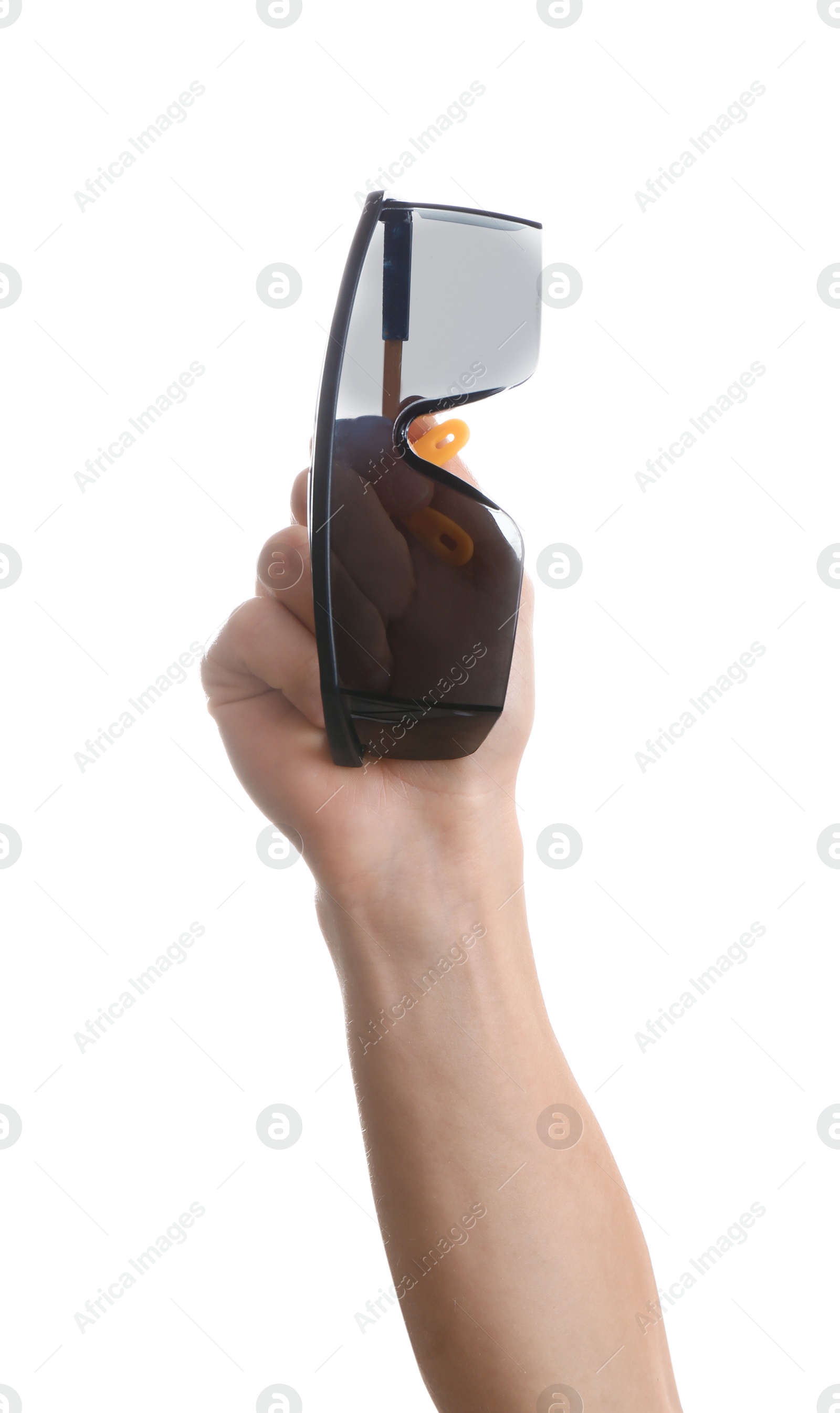 Photo of Construction worker holding protective goggles isolated on white, closeup