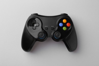 Photo of Wireless game controller on light grey background, top view