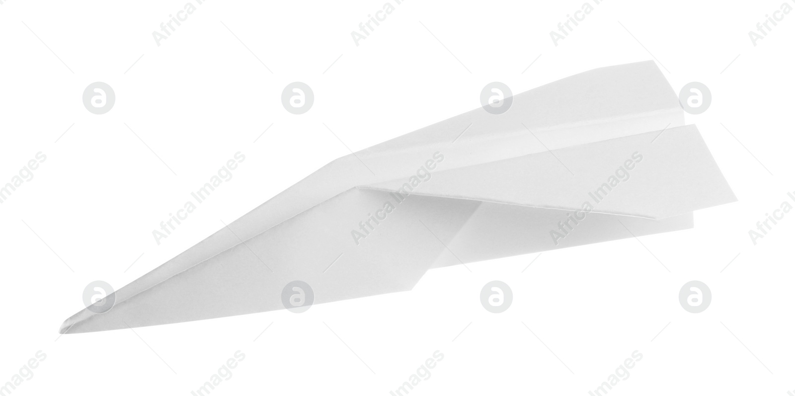 Photo of One handmade paper plane isolated on white