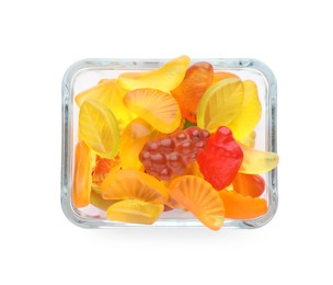 Tasty jelly fruit shaped candies in bowl on white background, top view