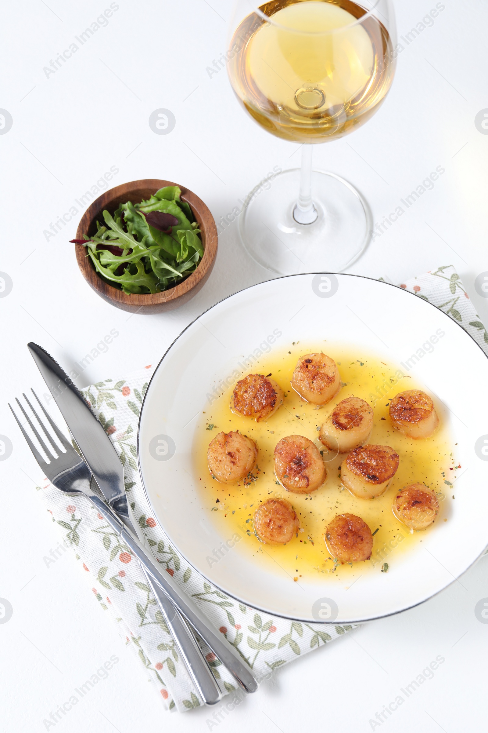 Photo of Delicious fried scallops served on white table