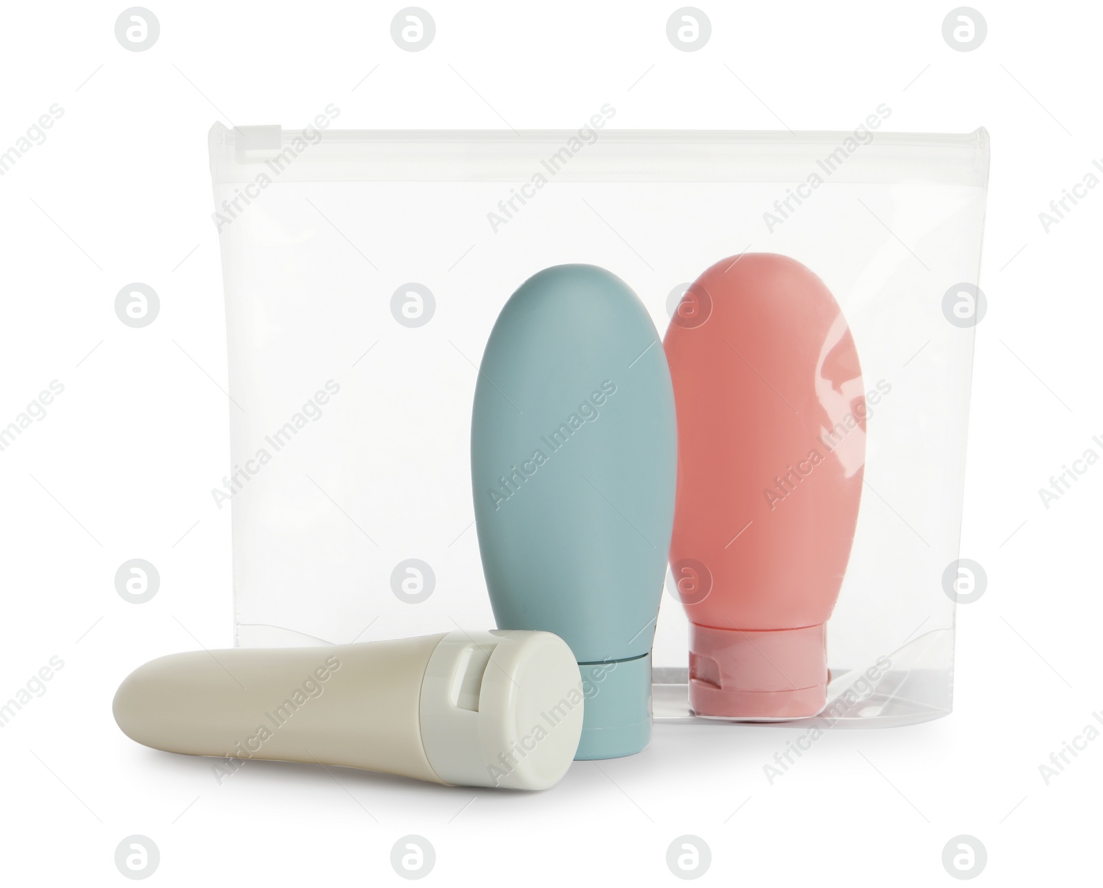 Photo of Cosmetic travel kit with plastic bag isolated on white