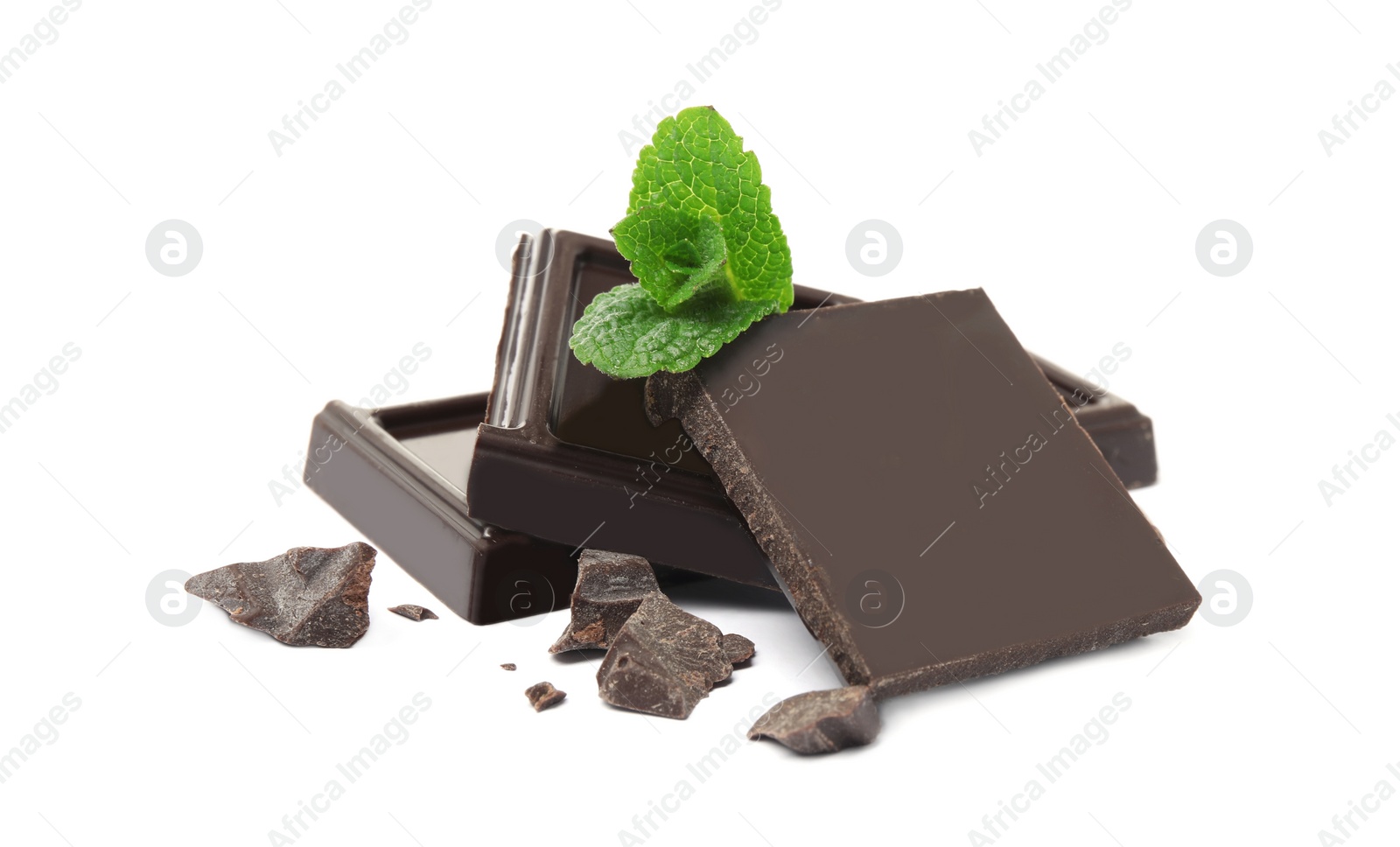 Photo of Tasty dark chocolate pieces with mint on white background