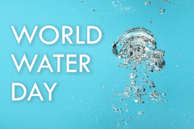 Image of Text World Water Day and air bubbles in water on light blue background