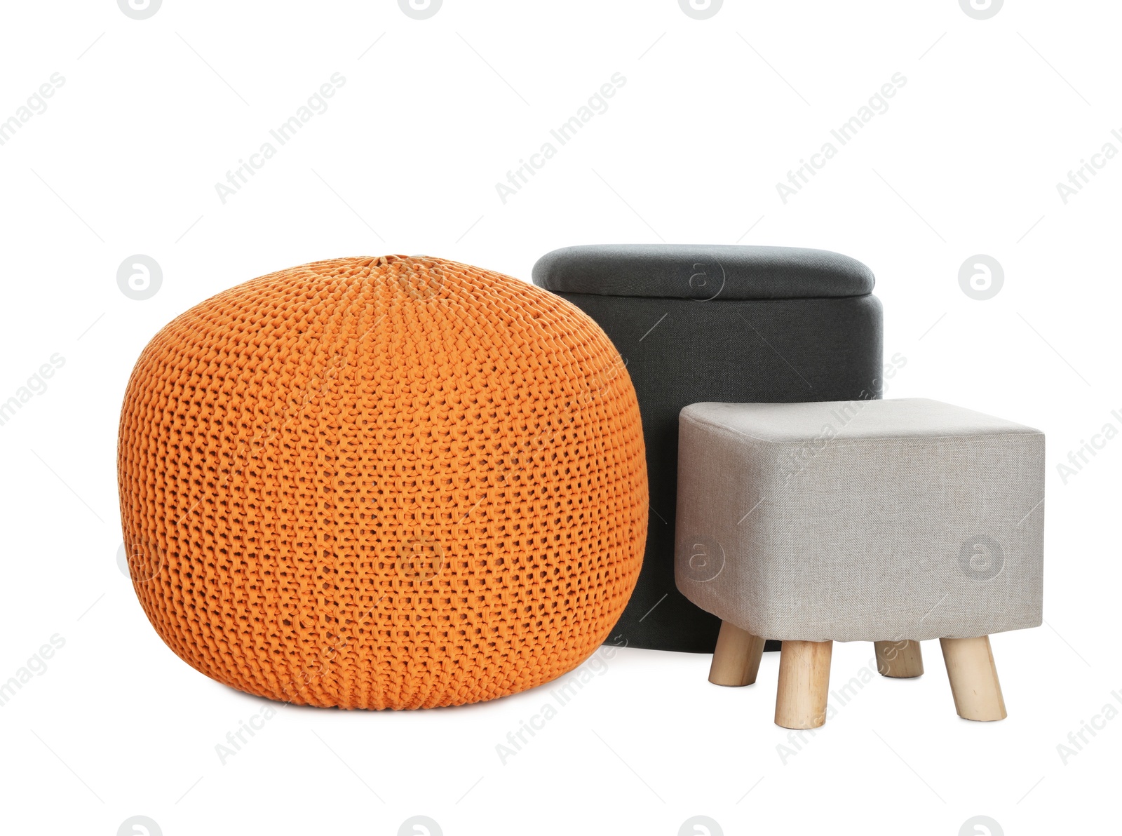 Photo of Different poufs on white background. Home design
