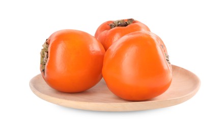 Photo of Delicious ripe juicy persimmons in wooden plate isolated on white