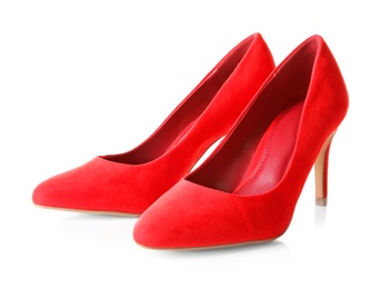 Photo of Pair of red female shoes on white background