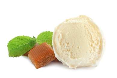 Photo of Delicious ice cream with caramel candies and mint on white background