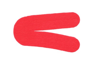 Red kinesio tape piece on white background, top view