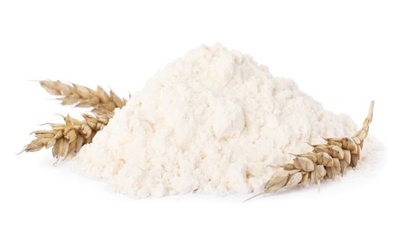 Pile of wheat flour and spikes isolated on white