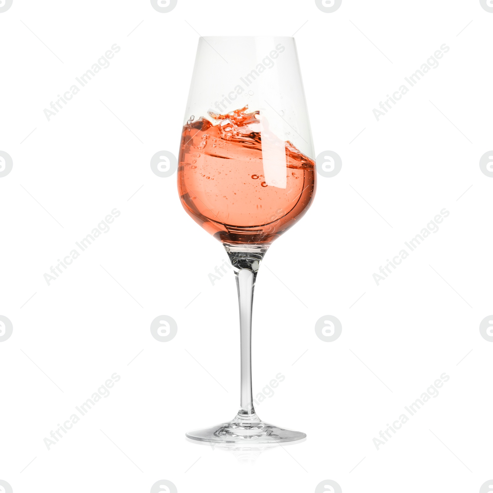 Image of Rose wine splashing in glass on white background