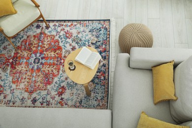 Photo of Stylish living room with beautiful carpet and furniture, top view. Interior design