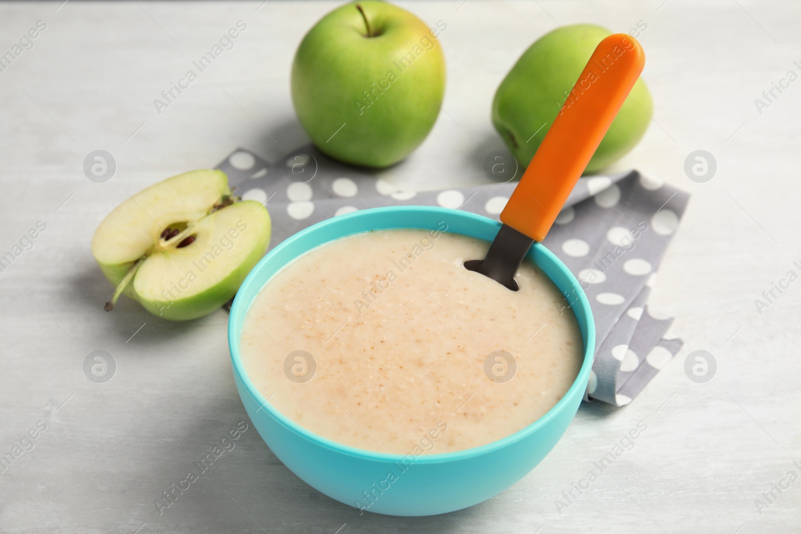 Photo of Bowl of healthy baby food on light table