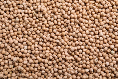 Photo of Many chickpeas as background, top view. Natural food