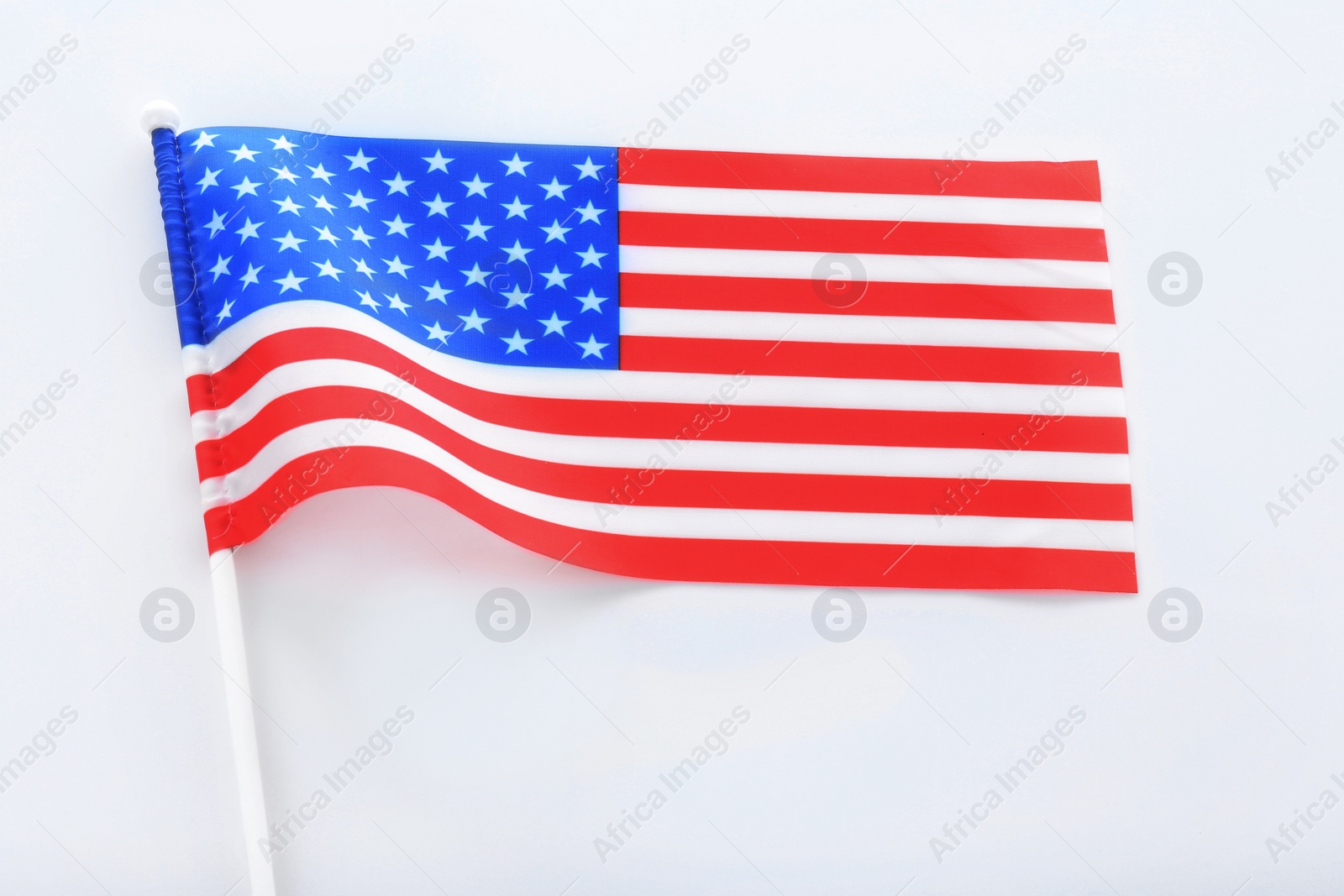 Photo of American flag on white background, top view