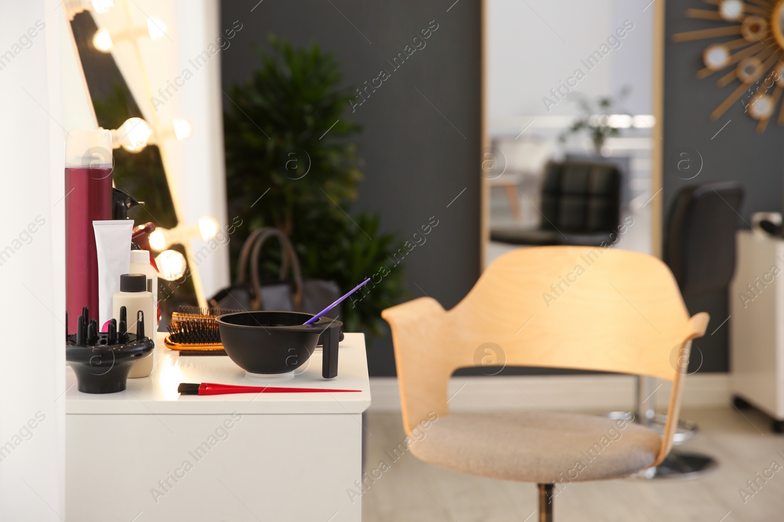 Photo of Workplace with hair dye kit in beauty salon