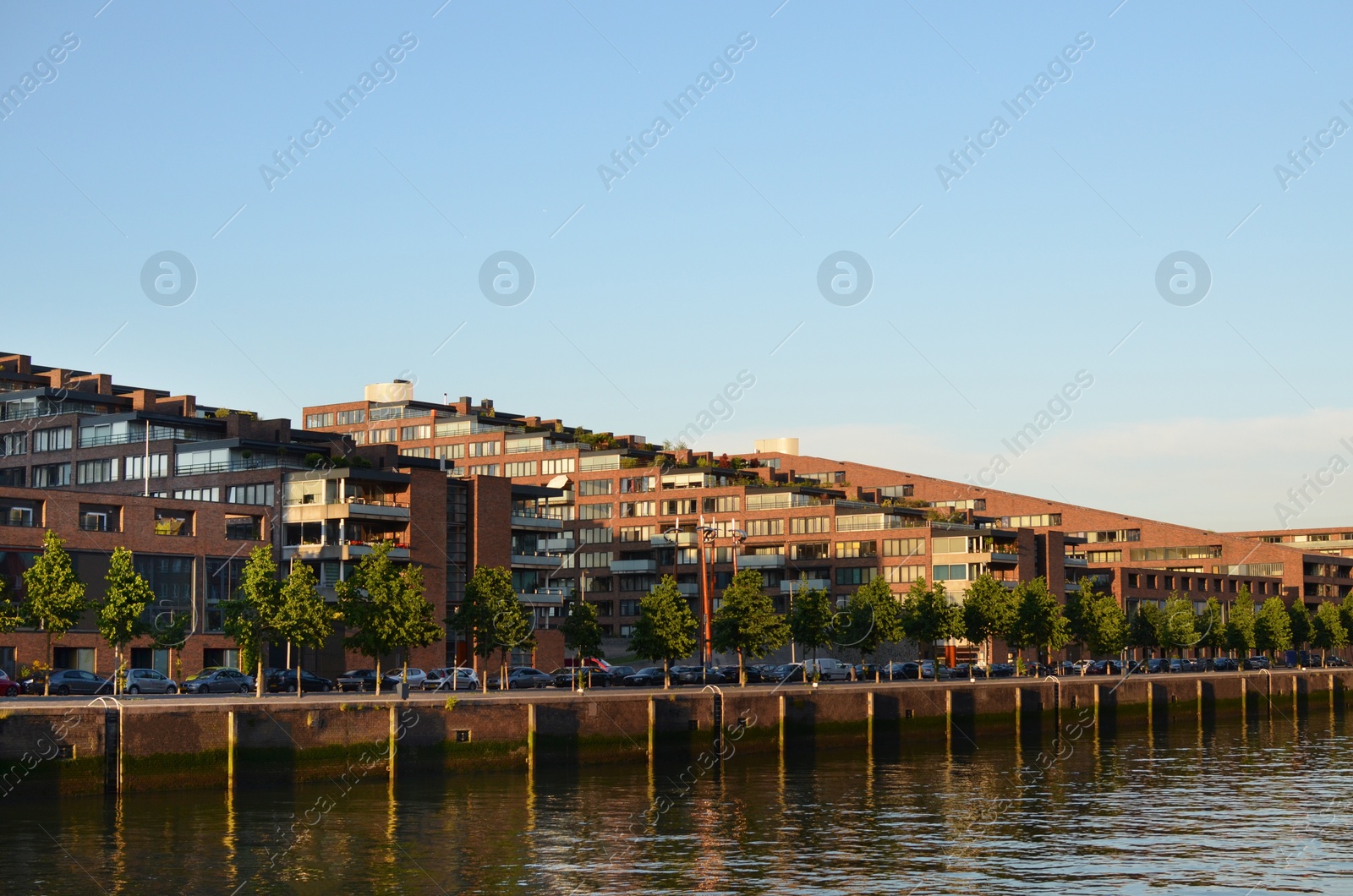 Photo of Beautiful view of modern buildings and road along river