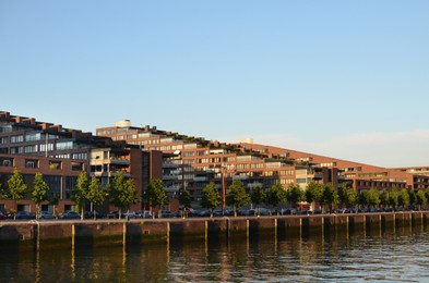 Beautiful view of modern buildings and road along river