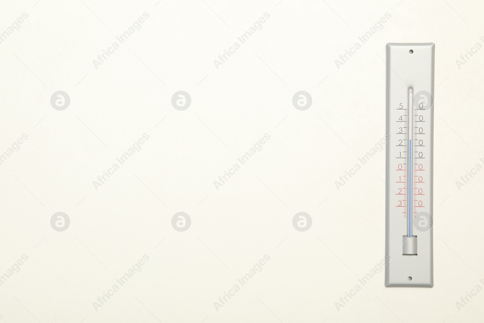 Photo of Weather thermometer on white background, top view. Space for text