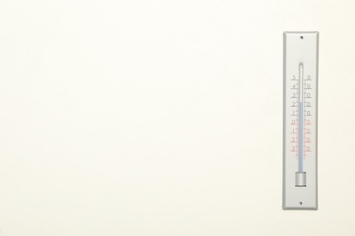 Photo of Weather thermometer on white background, top view. Space for text