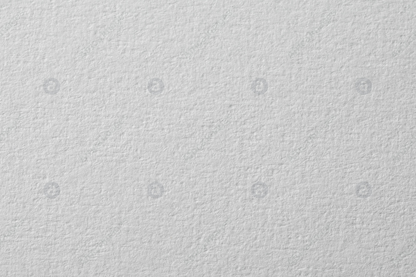 Photo of Texture of white paper sheet as background, closeup