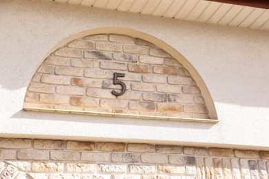 Photo of House number 5c on brick building outdoors