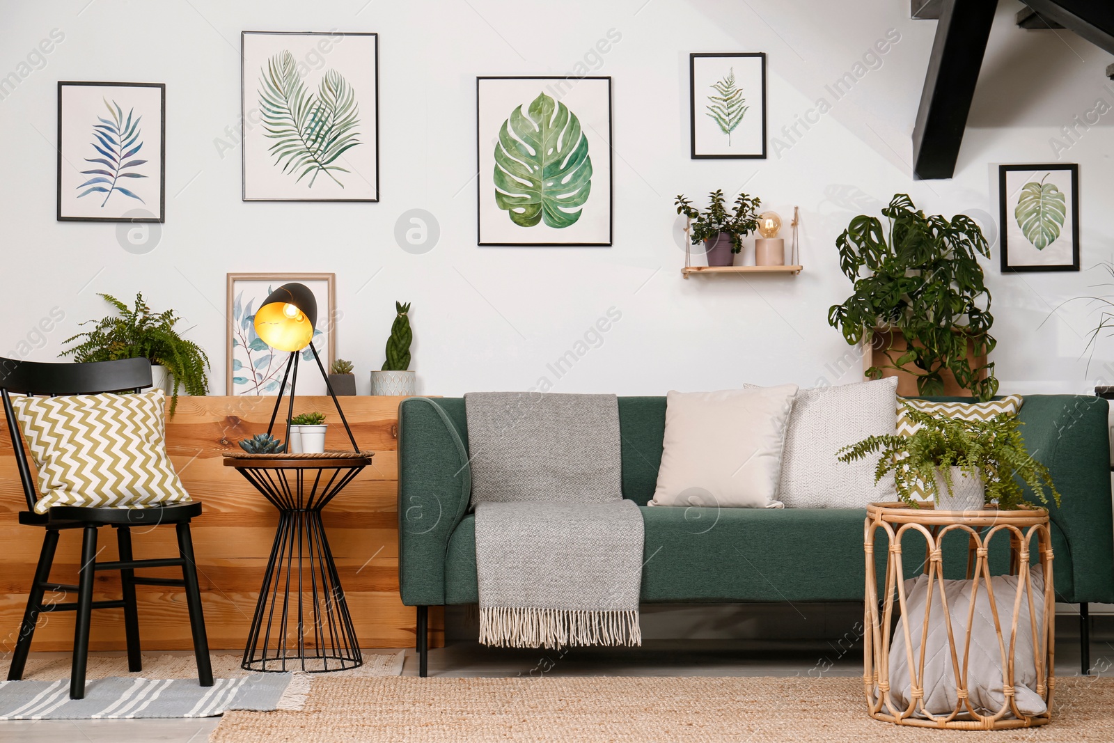 Photo of Stylish living room interior with comfortable sofa and green plants