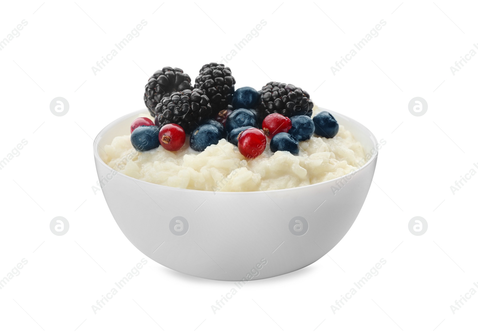 Photo of Delicious rice pudding with berries isolated on white