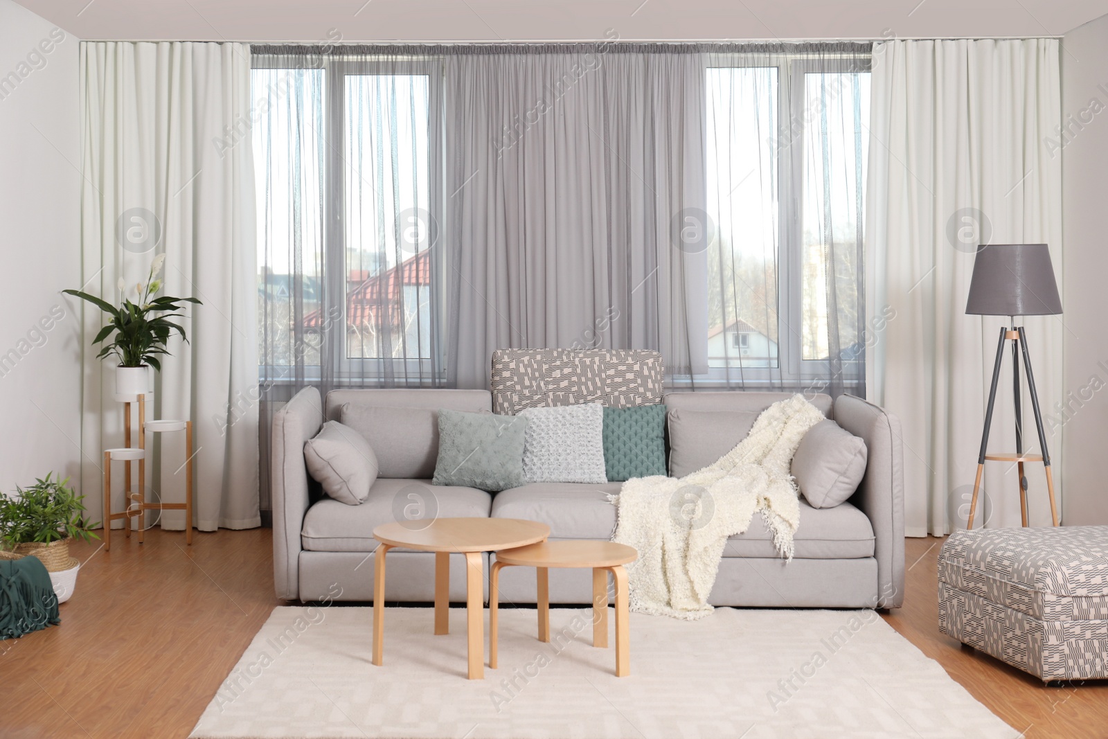 Photo of Windows with stylish curtains in living room interior