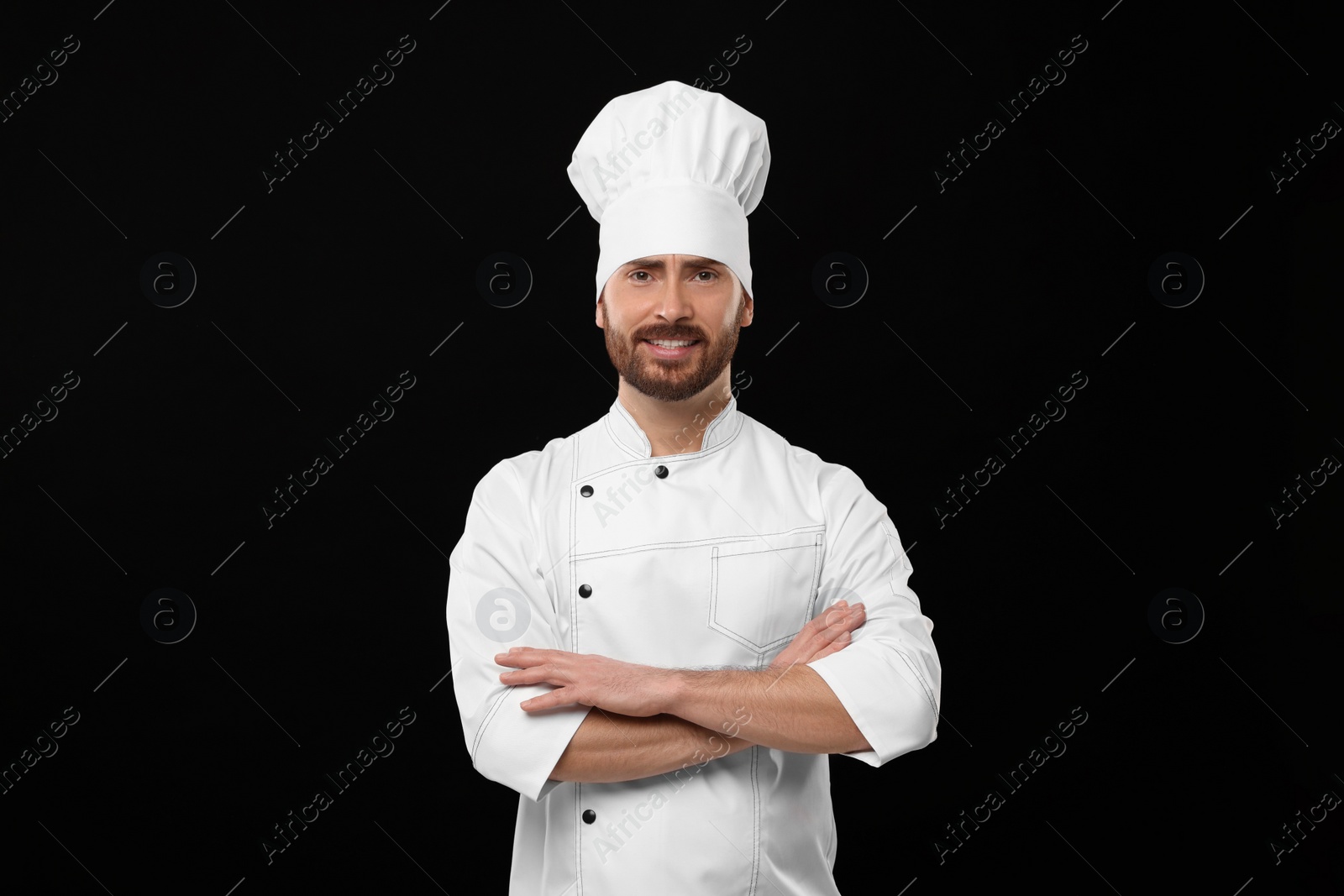 Photo of Smiling mature chef on black background, space for text