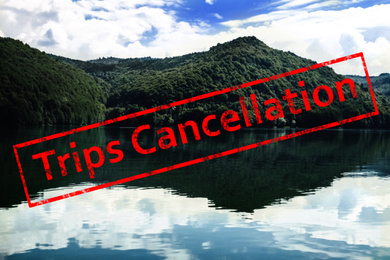 Trips cancellation during coronavirus quarantine. Beautiful lake surrounded by mountains